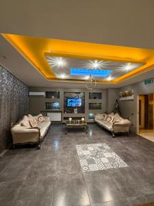 a large living room with couches and a television at Kral As Suite Hotel in Istanbul +43 photos