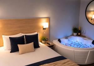 a bedroom with a bathtub and a bed and a tubitures at Casa Bella Boutique Hotel in Antigua Guatemala +62 photos