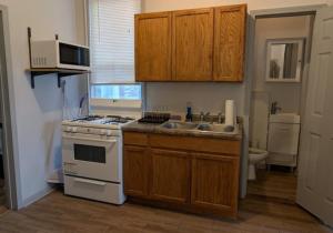 a kitchen with a sink and a stove top oven at Stay Chicago in Chicago