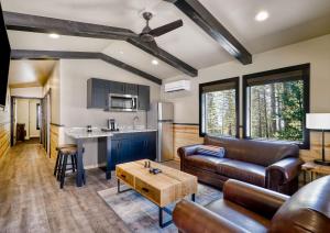 a living room with a couch and a table at Waybound Yosemite in Fish Camp