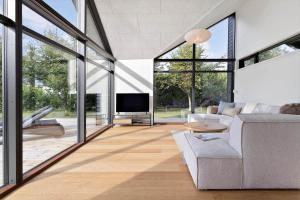 a living room with a couch and a tv at 30315-Odder-Grindevej-22 in Odder