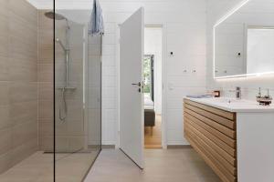 a bathroom with a shower and a sink at 30315-Odder-Grindevej-22 in Odder +19 photos