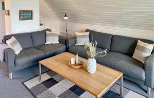 a living room with a couch and a coffee table at Awesome Home In Haderslev With Wifi in Haderslev