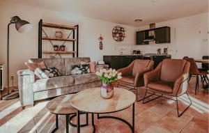 a living room with a couch and a table at Kaapstad in Naarden