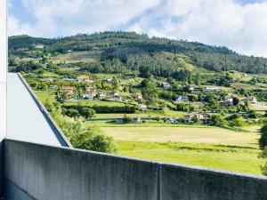 a view of a mountain from a house at Ibis Oviedo in Oviedo +64 photos