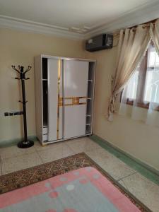 an empty room with a door and a cross on the wall at sweet Atlas hollydays in Azrou