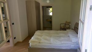A bed or beds in a room at Villa Dina