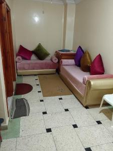a living room with two couches on the floor at sweet Atlas hollydays in Azrou