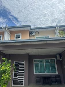 a house with a air conditioner on top of it at FE Homestay in Tawau