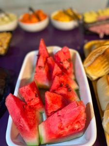 a tray of watermelon slices on a table at Hotel Brasilia in Aracaju