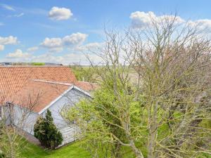 an overhead view of a house with a roof at Lush holiday home in Thyholm in Thyholm