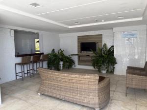 a living room with a couch and a tv at Sol e Mar Solar do Atlântico-Tambaú-João Pessoa in João Pessoa +31 photos