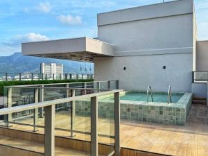 a swimming pool on the roof of a building at Franklin Studio Prime Rio Energy - Piscina, Sauna, Academia in Rio de Janeiro