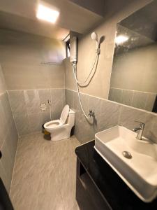a bathroom with a sink and a toilet and a mirror at The Up Koh Rong in Kaôh Rŭng (3)