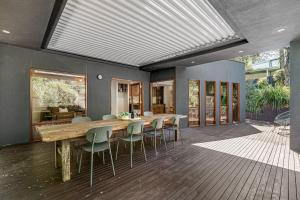 a dining room with a wooden table and chairs at Guest room in Stirling in Stirling