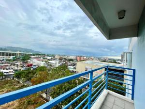 a balcony with a view of a city at Nier Haven at The Loop North Tower in Pontud