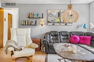 a living room with a couch and a table at 20103-Samso-Teglvaerksvej-2 in Brundby