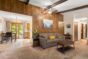 a living room with a couch and a table at Cedar Trees Retreat in Sandpoint