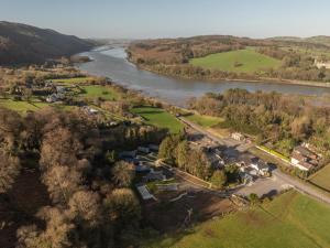 an aerial view of a river and a village at Narrow Water Lodges in Cornamucklagh