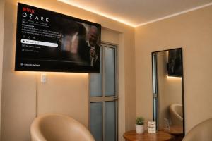 a room with a flat screen tv on the wall at Hotel Zackenbarsch in Huánuco