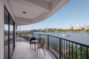 a balcony with a view of the river at Fraser Residence Putrajaya in Putrajaya