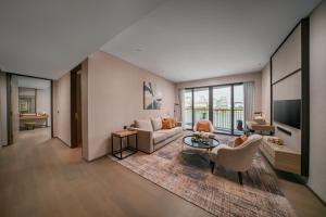 a living room with a couch and a table at Fraser Residence Putrajaya in Putrajaya