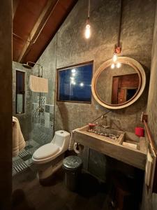 a bathroom with a sink and a toilet and a shower at Macpalo in Amatlán +43 photos