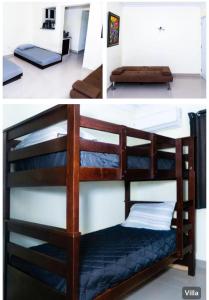 a bunk bed in a room next to a bedroom at Villa bonita mar in Concepción de La Vega