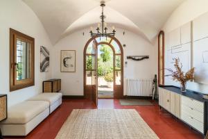a living room with a couch and an open door at Luxury Villa El Turo in Castellví de Rosanés +47 photos