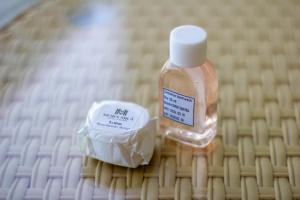 a bottle of mouthwash sitting on a table at Mora Mila in Arugam Bay