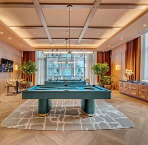 a billiard room with a pool table at Viceroy Residences in Miami