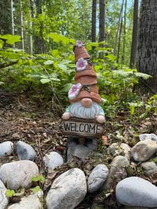 a garden statue sitting on a pile of rocks at Cozy Vintage Camper, the Tealy Wheely in Golden +49 photos