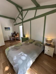 a bedroom with a large bed in a room at Bois sauvage in Parentis-en-Born