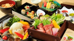 a bunch of different types of food on a table at ゆるり熱海withDOGS in Atami