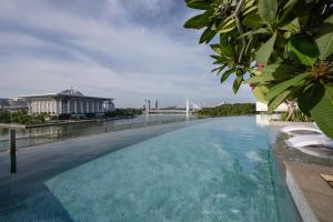 a large swimming pool on the roof of a building at Fraser Residence Putrajaya in Putrajaya