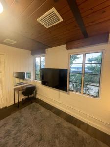 an empty room with a desk and a large window at Hotel-Style Private Suite-Lake View-Gardens in Lake Wales
