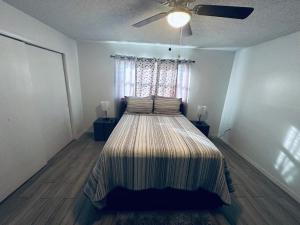 a bedroom with a bed and a ceiling fan at Beautiful Brand-New studio in New Port Richey