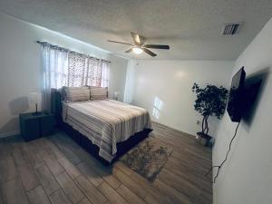 a bedroom with a bed and a ceiling fan at Beautiful Brand-New studio in New Port Richey