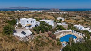 an aerial view of a house on a hill with a pool at Belogna Ikons in Vívlos