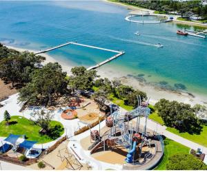 an aerial view of a water park with a roller coaster at Budget Friendly Accommodation in Mandurah +19 photos