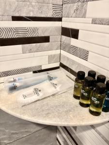 a tray with four bottles of essential oils on a counter at Kea Garden Guest House in Brinchang +30 photos