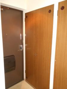 a door leading into a room with a door at メープル桑園駅202 in Sapporo