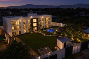 an aerial view of a building with a garden at night at Lucmar Jardín boutique in Cuernavaca