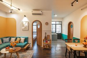 a living room with a couch and a table at Spacious Hoan Kiem Apartment in Hanoi