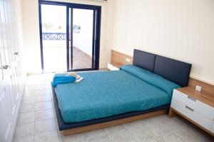 Postel nebo postele na pokoji v ubytování Villas Coloradas