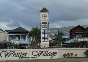 a clock tower in front of a shopping mall at The Chill Spot in Mo Bay in Crooked River +6 photos
