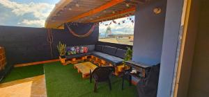 a living room with a couch and a table at Apartamento con terraza - Kalimalake in Darién