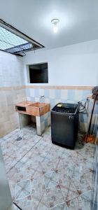 a bathroom with a tub and a tv in a room at Apartamento con terraza - Kalimalake in Darién +12 photos