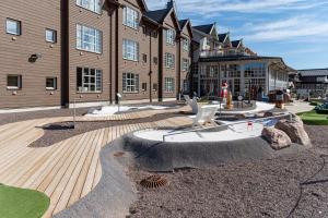 a large building with a fire hydrant in front of it at Bruna Byn in Sälen +9 photos