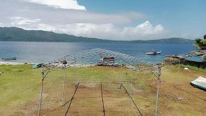 a net on the side of a body of water at Blue Rose Resort & Dive Center in Pattimura Airport